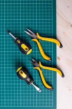 Tools on the green checked mat Stock Photos