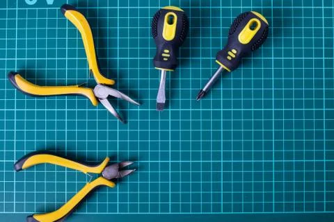Tools on the green checked mat Stock Photos