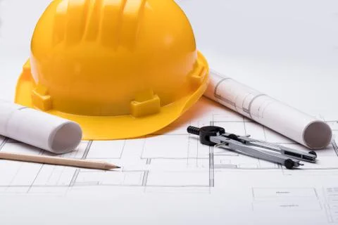 Tools With Hardhat On Blueprint Stock Photos
