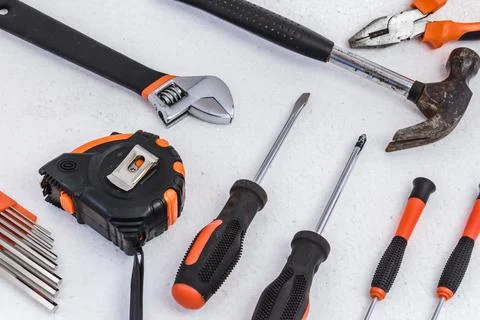 Tools for housework and construction applications on a white background. Stock Photos