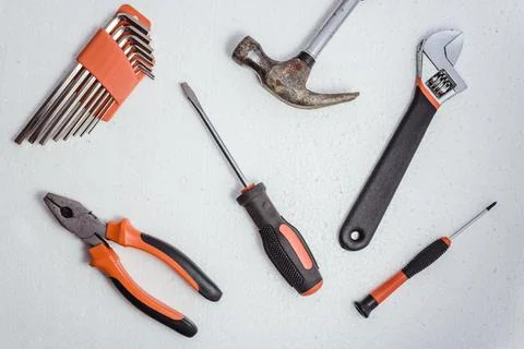 Tools for housework and construction applications on a white background. Stock Photos