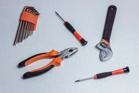 Tools for housework and construction applications on a white background. Stock Photos