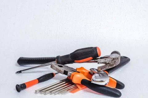 Tools for housework and construction applications on a white background. Stock Photos