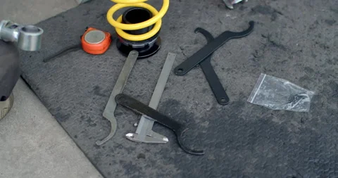 Tools for installing shock absorbers.Shock absorbers with adjustable height. Stock Footage 310015102