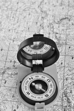 Tools for the journey - map and compass. Stock Photos