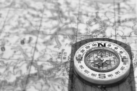 Tools for the journey - map and compass. Stock Photos