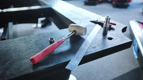 Tools Laid Out for Billiard Table Restoration in Indoor Workshop - Riga Latvia Stock Footage 310315294