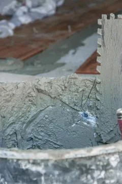  Tools for laying tiles on floor at construction site. Industry building concept Stock Photos