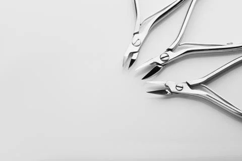 Tools of a manicure scissors on a white background Stock Photos