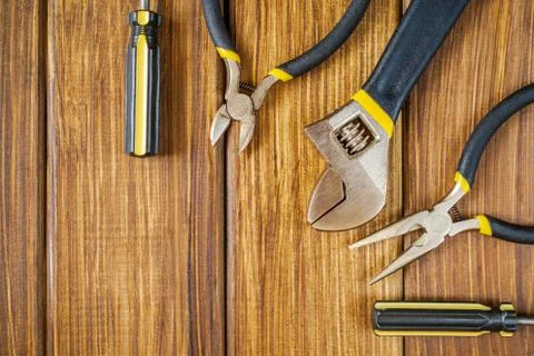 Tools for master builder and accessories on wooden vintage background Stock Photos