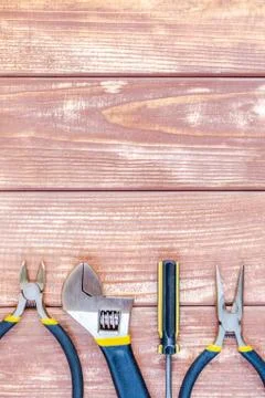 Tools for master builder and accessories on wooden vintage background Stock Photos