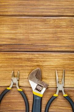 Tools for master builder and accessories on brown wooden vintage background Stock Photos