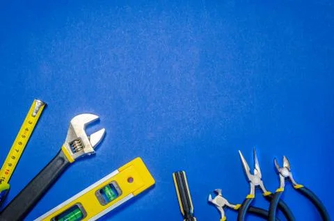 Tools for master builder and accessories on blue background Stock Photos