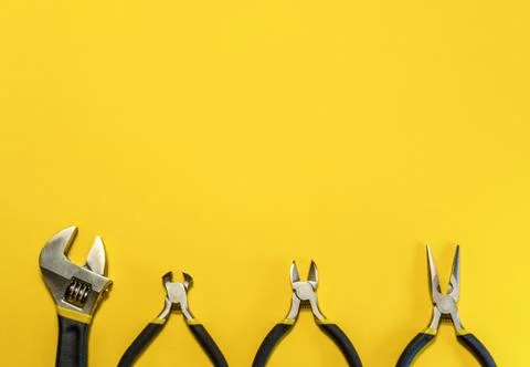 Tools for master builder and accessories on yellow background Stock Photos