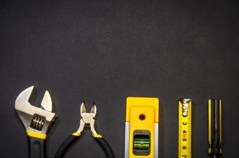 Tools for master builder on a black background Stock Photos