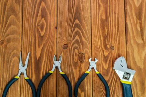 Tools for master builder prepared before work on a brown wooden boards Stock Photos