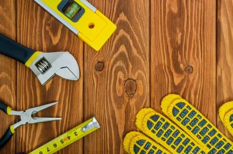 Tools for master builder prepared before work on a brown wooden boards Stock Photos