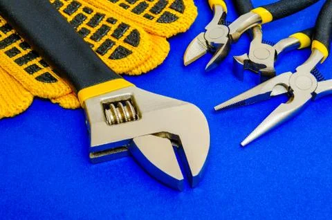 Tools for master builder prepared before work on blue background Stock Photos