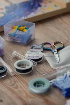The tools of the master weaving from beads lies Stock Photos