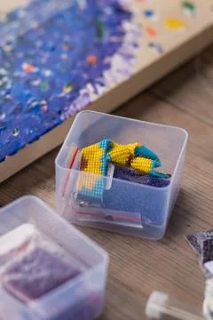The tools of the master weaving from beads lies Stock Photos