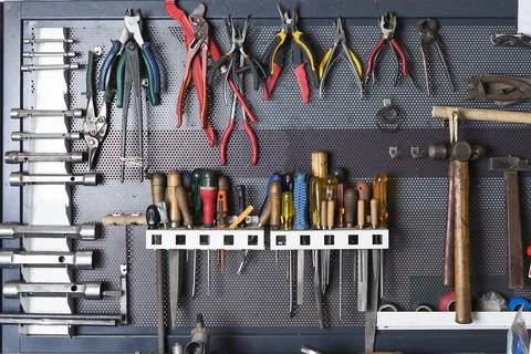 Tools on a metal board .. Stock Photos