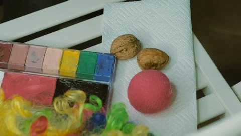 Tools: paint ,brushes, liquid - Aqua, body art. Make-up for the clown Stock Footage 90358183