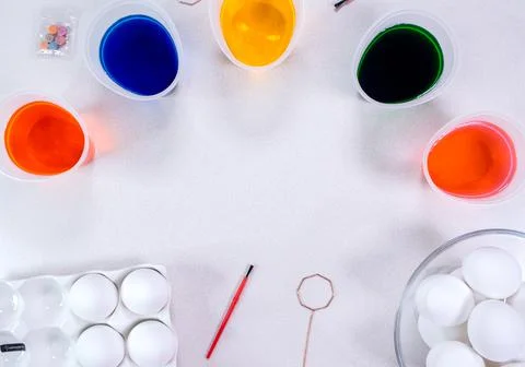 Tools for painting eggs for easter, eggs box, cups of colorful paint, easter Stock Photos