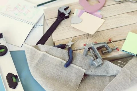 Tools, paper mustache, notepad, congratulation on a wooden table, top view Stock Photos