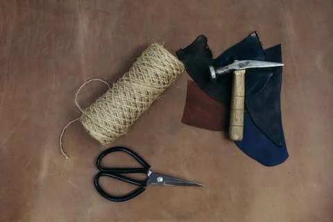 Tools pattern. Hammer, scissors in leather. Background with sewing and knitting Stock Photos