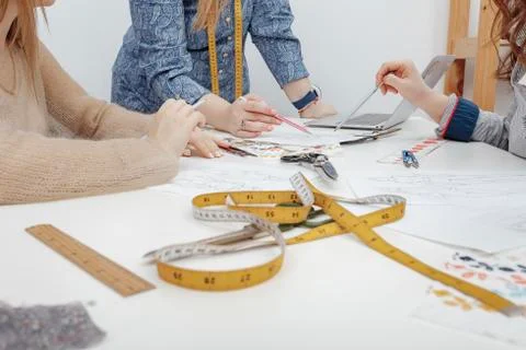 Tools of professional designers and process of tailoring Фото