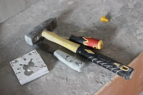 Tools for repair and construction works: a ladder, a trowel, a hammer. repair Stock Photos