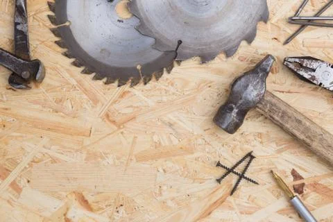 Tools set on osb panel with copy space. Carpenter workplace on wooden background Stock Photos