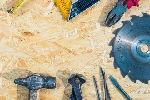 Tools set on osb panel with copy space. Carpenter workplace on wooden background 스톡 사진