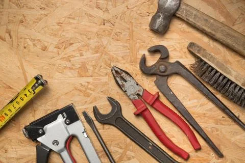 Tools set on osb panel with copy space. Carpenter workplace on wooden background Stock Photos