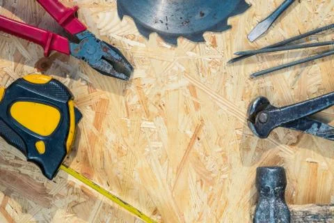 Tools set on osb panel with copy space. Carpenter workplace on wooden background 스톡 사진