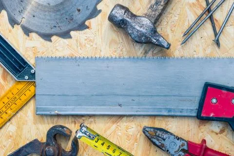 Tools set on osb panel with copy space. Carpenter workplace on wooden background Foto stock