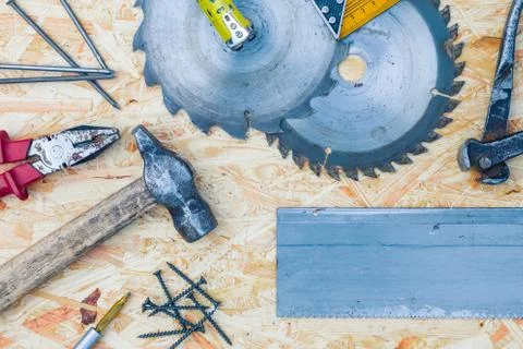 Tools set on osb panel with copy space. Carpenter workplace on wooden background Foto stock