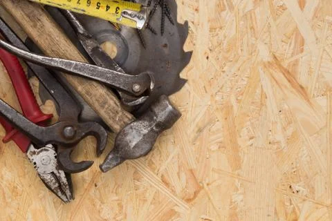 Tools set on osb panel with copy space. Carpenter workplace on wooden background Stock Photos