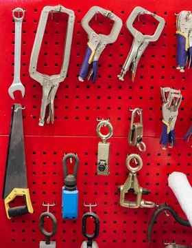 Tools on the table and board. Garage, car shop. Special vehicle repair tool. Stock Photos