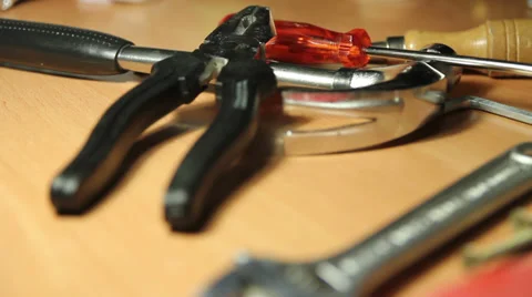 Tools on a table, close up. A worker grabs one Stock Footage 33365523