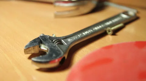 Tools on a table, close up. A workers hand grabs one Stock Footage 33365564