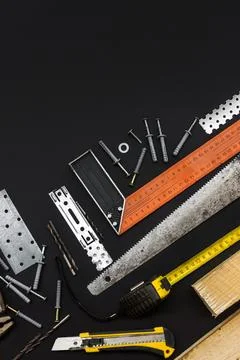 Tools for various types of work. Black background. Top view. Copy space Foto stock