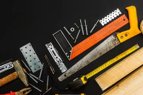 Tools for various types of work. Black background. Top view. Copy space Foto stock