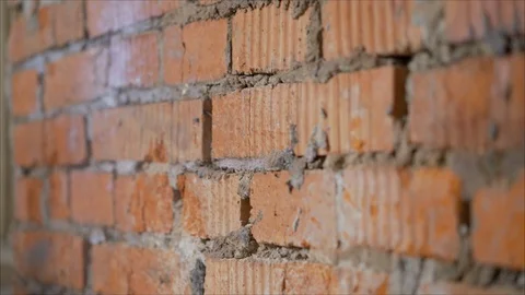 Tools for waterproofing. Primer a brick wall with a primer Stock Footage 113765060