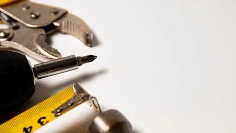 Tools on a white background with space for text. Top view. Stock Photos