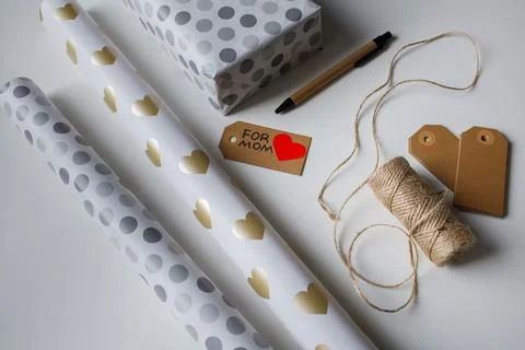 Tools for wrapping a present in gift paper for mom top view Stock Photos