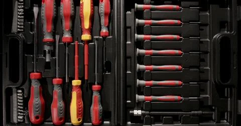 Toolset with assorted screwdrivers and attachments organized in a case for easy Stock Photos