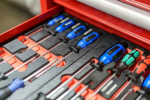 Toolset with various screwdrivers in a red toolbox organized for easy acces.. Stock Photos