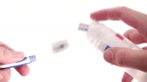 Tooth brush and paste in hands Stock Footage 309032