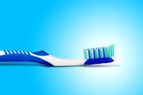 Tooth brush in blue background Stock Photos